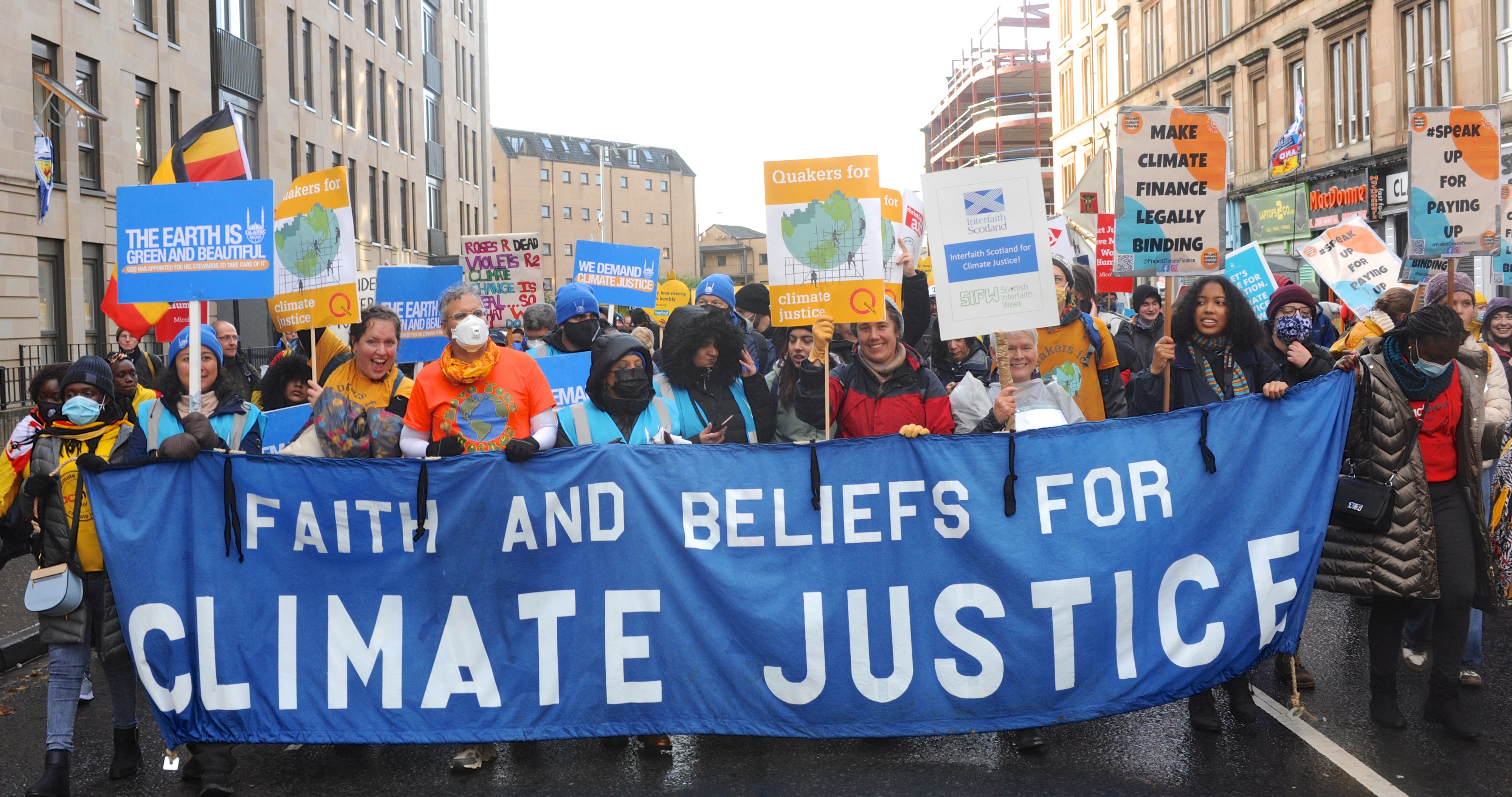 Quakers, faith leaders and others marching at COP26