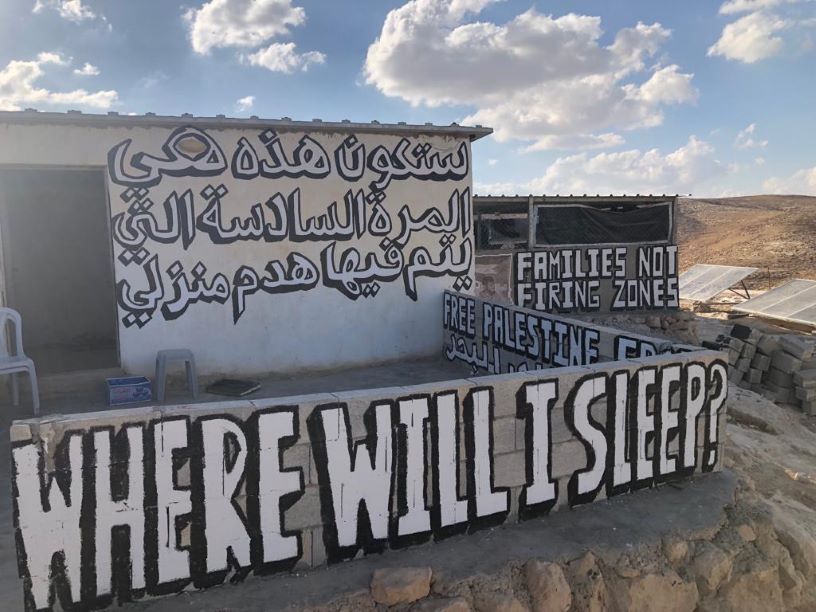 Graffiti in Arabic reading This will be the sixth time my house has been demolished