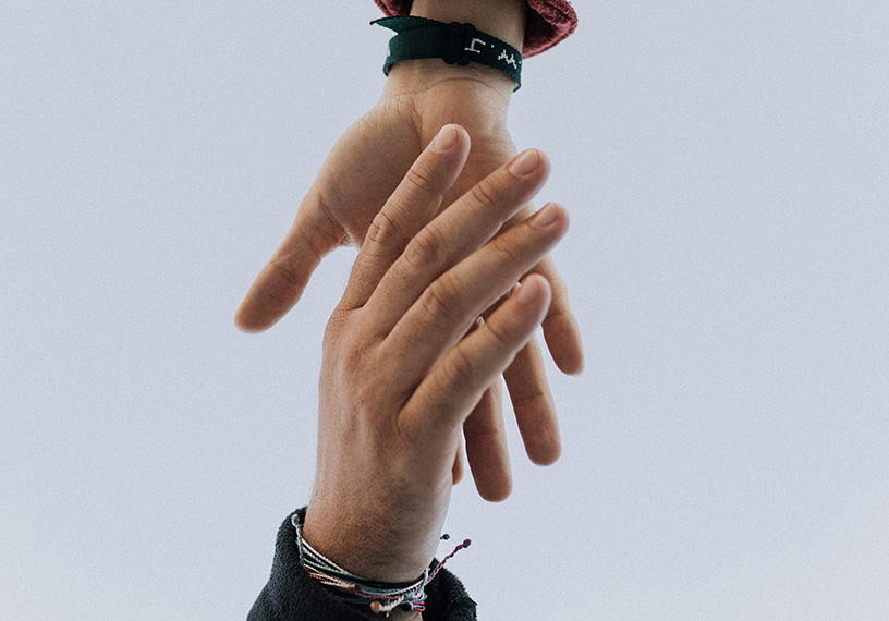 Hands reaching towards each other