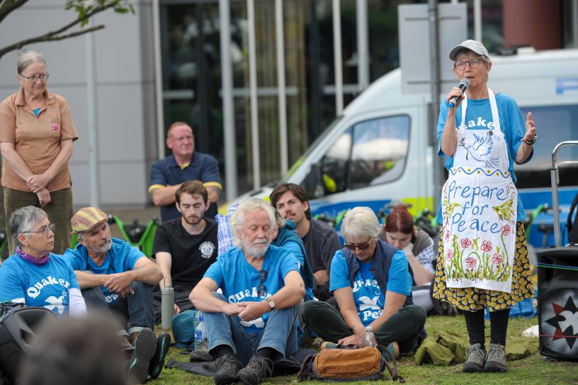 People listening to ministry outside