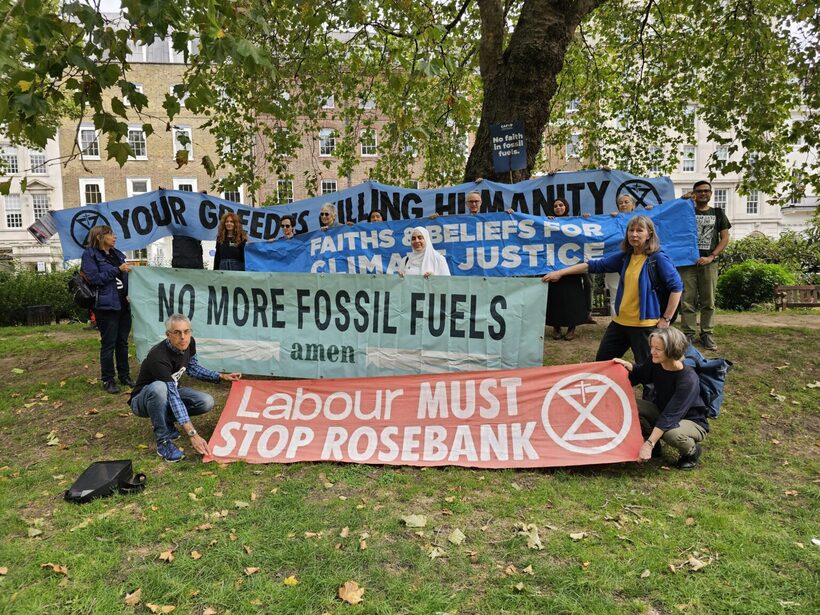 Banners at an interfaith vigil call for political action for climate justice. Help us work to make sure MPs, MSPs, and others understand the climate crisis and how seriously we take it. Photo by Faith for the Climate