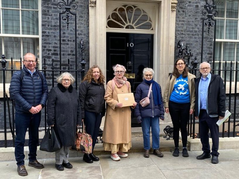 Six people standing in front of 10 Downing Street